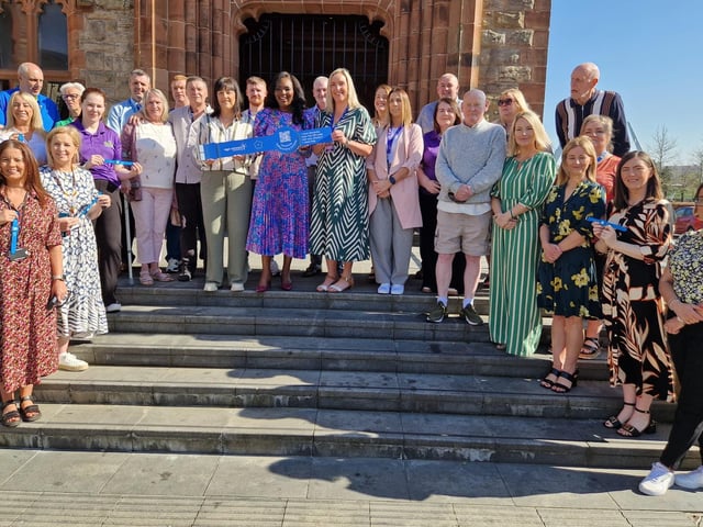 The Mayor of Derry and Strabane Lilian Seenoi-Barr with representatives of the Western Trust, Age Concern Causeway, the Public Health Agency, Derry GP Federation, DEEDS and service users at the launch of the Age Concern Causeway Dementia Wristband initiative at the Guildhall.