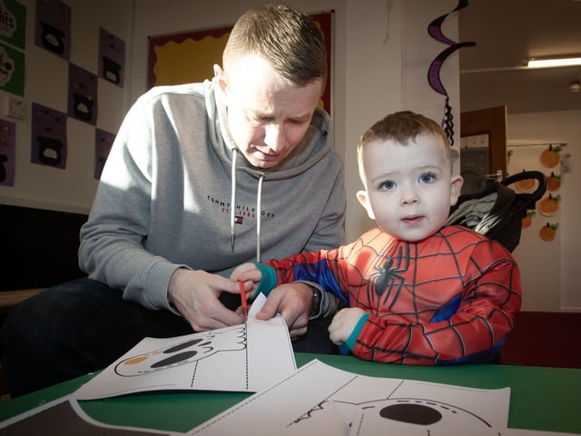 Caleb and his dad hard at work in making some Halloween decorations.