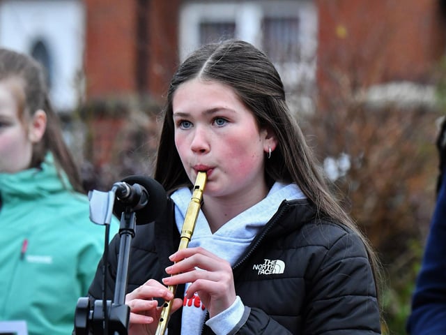 Sophie McIntyre plays a lament at the one minute silence dedicated to the children of Gaza at the Bloody Sunday monument on Thursday afternoon. Photo: George Sweeney