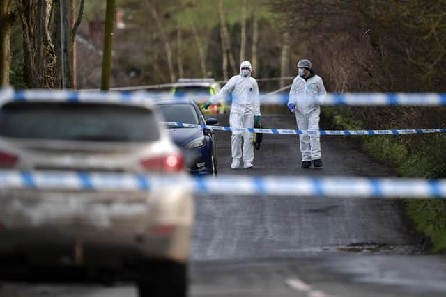 Police and forensics are seen at the scene of the shooting of a high profile PSNI officer at the Youth Sports Centre on February 23, 2023 in Omagh, Northern Ireland. The senior police officer, named as Detective Chief Inspector John Caldwell was shot four times as he put footballs into the boot of his car as he stood along side his son following a football training session. The PSNI have said that the "primary focus" of the police investigation is the involvement of violent dissident republicans. (Photo by Charles McQuillan/Getty Images)