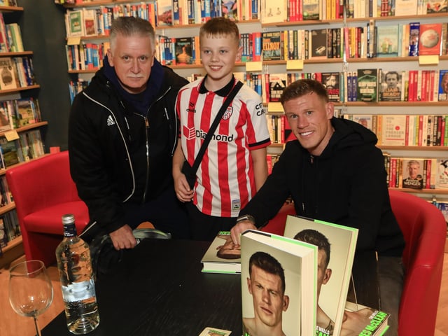 Professional footballer James McClean signing his autobiography, “The Walls” in Waterstones, Foyleside, for Paul Roddy and his grandson Luca. (Photo - Tom Heaney, nwpresspics)