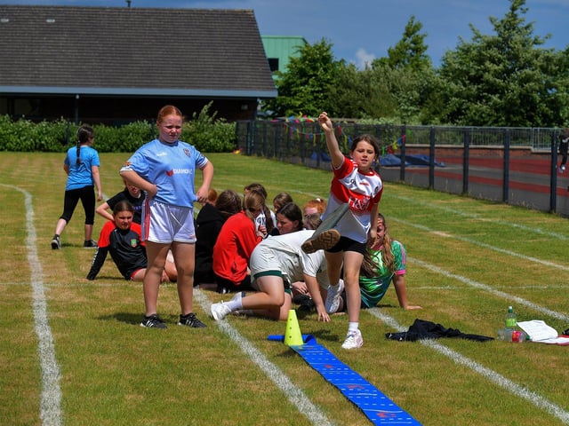 Tossing a ‘welly’ competition during at the Holy Child Primary School sports day held on Monday last. Photo: George Sweeney. DER2325GS – 005