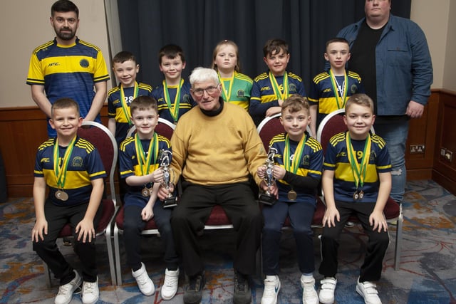 John ‘Jobby’ Crossan presenting the U8 Championship Summer and Winter Cups to Don Boscos Colts at the Annual Awards in the City Hotel on Friday night last. Included are coaches David Rankin and Jay Buckley.