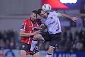 Derry’s Shane McEleney rises to challenge Patrick Hoban of Dundalk last season. Photograph by Ciaran Culligan