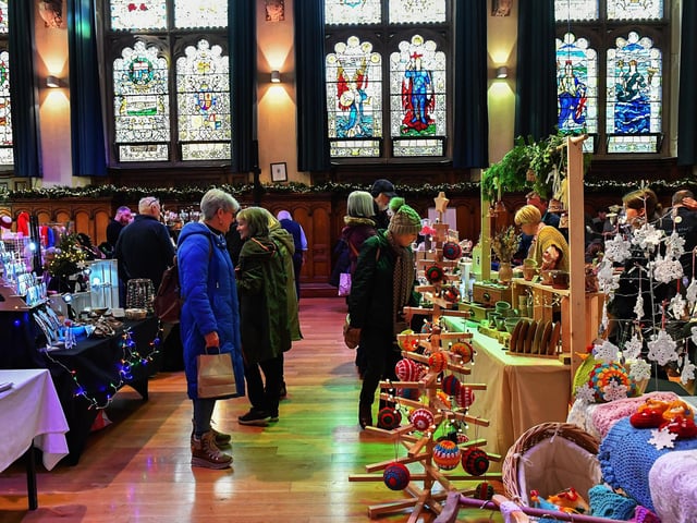 People browse the large range of gifts at the Guildhall Christmas Fair on Friday afternoon. Photo: George Sweeney / Derry Journal