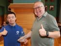 Kevin Morrison shows off his award with son Adam at the Guildhall on Wednesday evening.