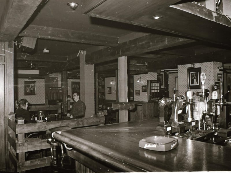 Customers and staff at Doherty's bar beside Castle Gate in Derry city centre.