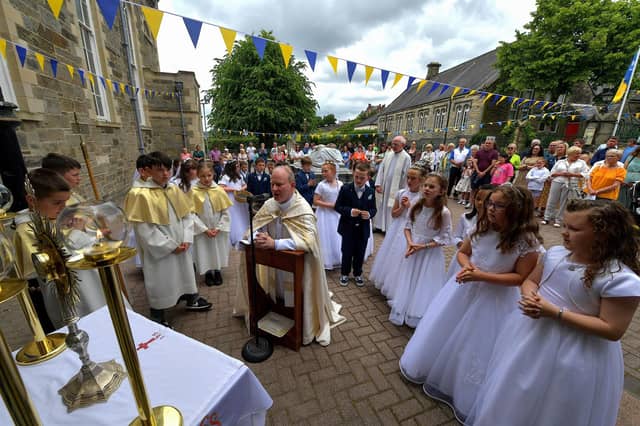 Fr. Gerard Mongan, administrator of St Columba’s Church, Long Tower, leads the prayers of Benediction at the Calvary during the Solemnity of Corpus Christi procession, held in the ground of the church on Sunday afternoon. Photo: George Sweeney. DER2324GS –