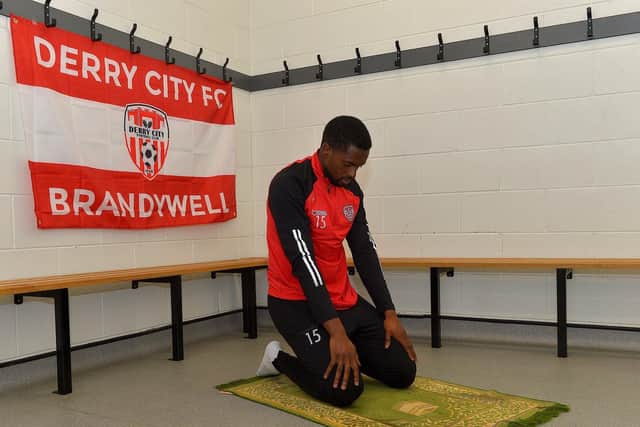 Derry City midfielder Sadou Diallo prays on his prayer rug at the Ryan McBride Brandywell Stadium. Photo: George Sweeney. DER2308GS – 18