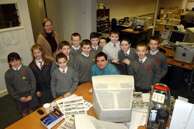 John Gill with students during a visit to the Journal offices in Buncrana Road.