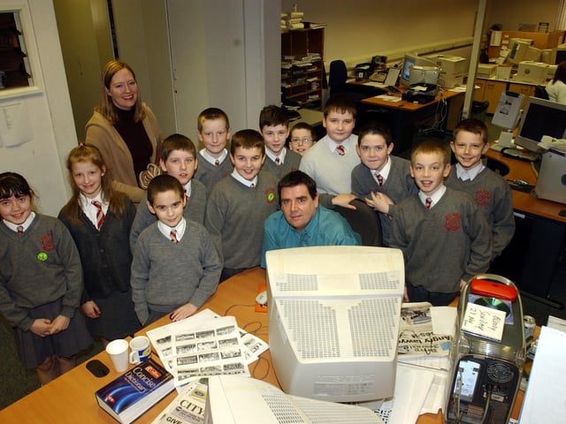 John Gill with students during a visit to the Journal offices in Buncrana Road.