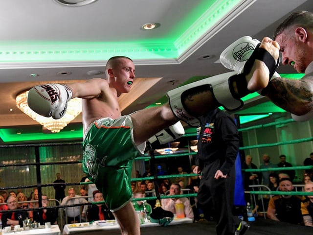 Rathmor Warriors’ Jake Mooney (left) defeated Dennis Lafferty, SMAA,  to win the Lightweight LK Irish Title, on Saturday evening last, in the Everglades Hotel. Photo: George Sweeney.  DER2312GS – 68