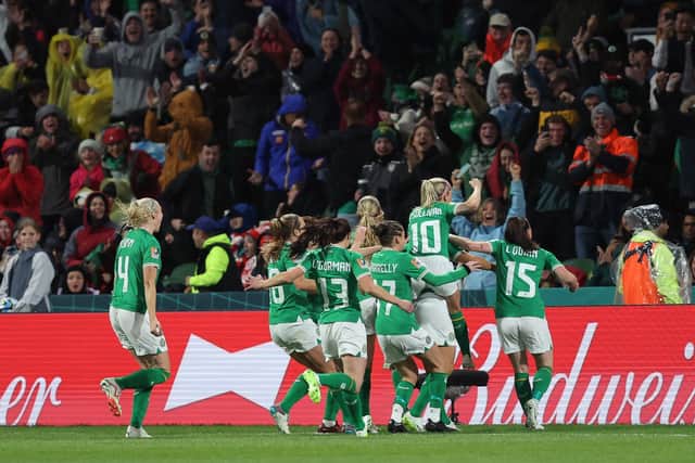 PERTH, AUSTRALIA - JULY 26: Republic of Ireland players celebrate the team's first goal scored by Katie McCabe (obscured)  during the FIFA Women's World Cup Australia & New Zealand 2023 Group B match between Canada and Ireland at Perth Rectangular Stadium on July 26, 2023 in Perth, Australia. (Photo by Paul Kane/Getty Images)