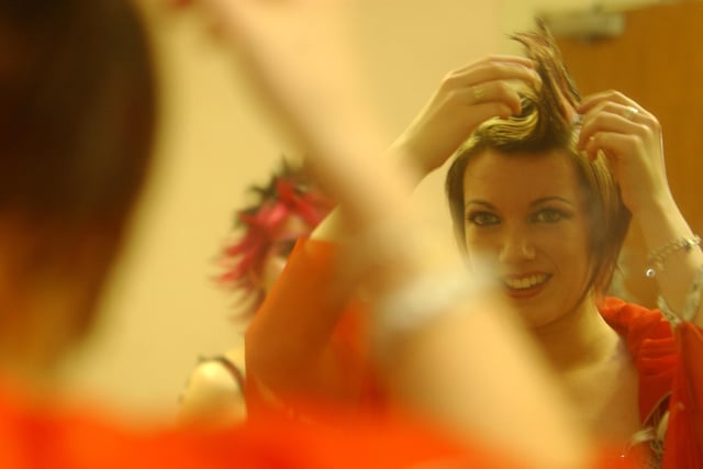Nicola Toland applies the finishing touches to her hair.