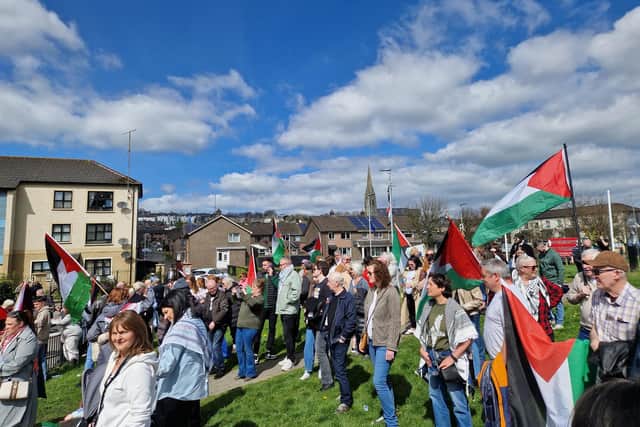 Protest to “Stop arming the genocide.”