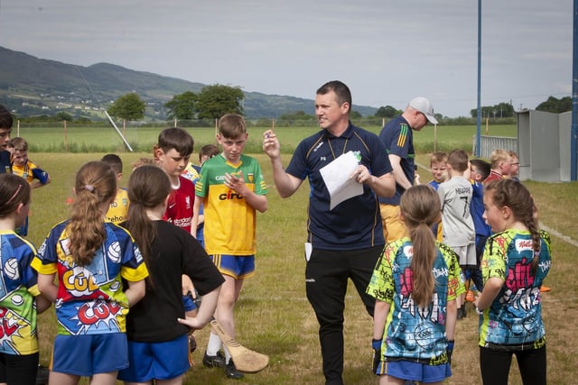 Paul Gillespie, Burt GAA coach, gives the young players some tips and advice at the club's Skills Day on Sunday last.