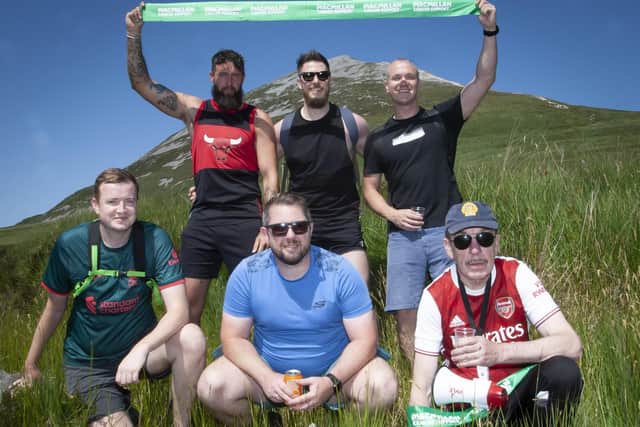 ORGANISING COMMITTEE. . . .Pictured on Thursday at the foot of Mount Errigal are the organising committee of the Housing Executive’s Mount Errigal Challenge. Front from left, Robert Guthrie, Neal Harkin and Noel McNulty. Back from left, Dane Harley, Andy Leitch and Ronan Campbell. (Photos: Jim McCafferty Photography)