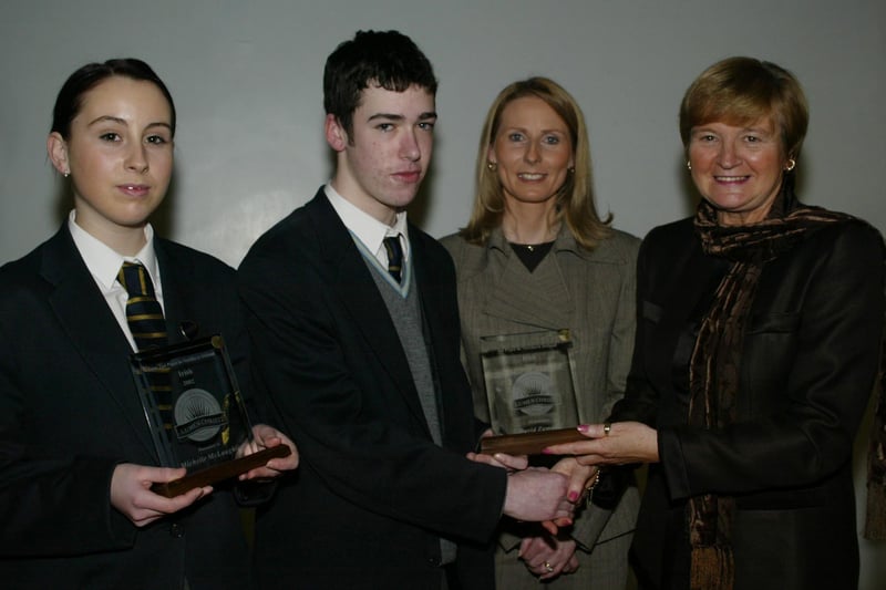 Michelle McLaughlin and David Zammitt who achieved 1st and 2nd place in NI in their GCSE Irish exams pictured receiving their awards from Marian Machett, Chief Inspector DENI.  Also in photo is Mrs Bronagh O'Hare.  (1001JB29)