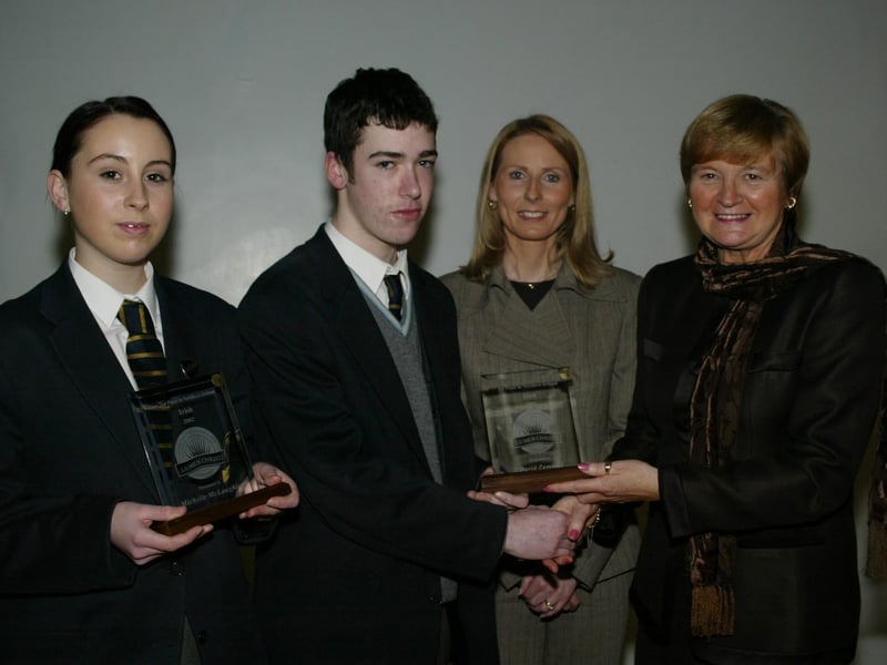 Michelle McLaughlin and David Zammitt who achieved 1st and 2nd place in NI in their GCSE Irish exams pictured receiving their awards from Marian Machett, Chief Inspector DENI.  Also in photo is Mrs Bronagh O'Hare.  (1001JB29)