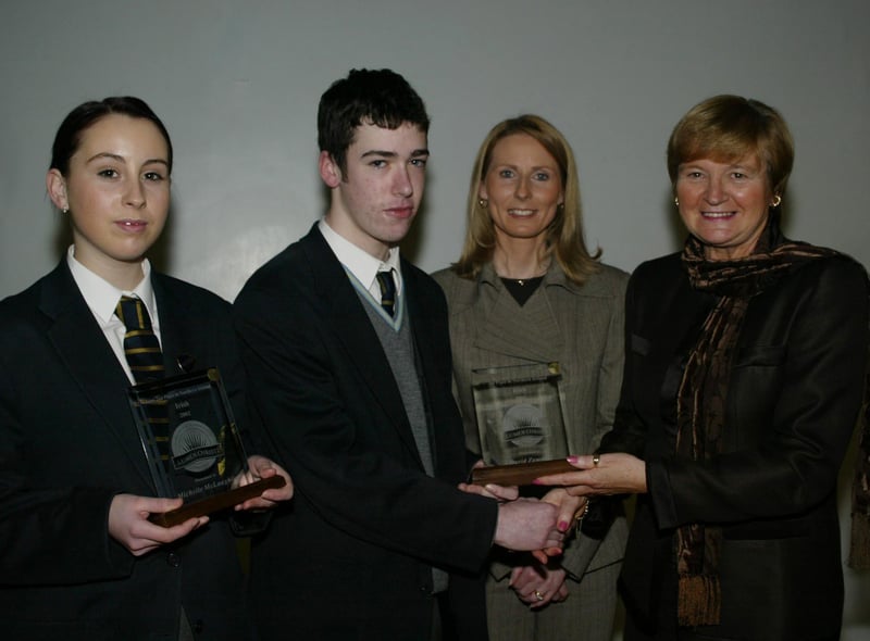 Michelle McLaughlin and David Zammitt who achieved 1st and 2nd place in NI in their GCSE Irish exams pictured receiving their awards from Marian Machett, Chief Inspector DENI.  Also in photo is Mrs Bronagh O'Hare.  (1001JB29)