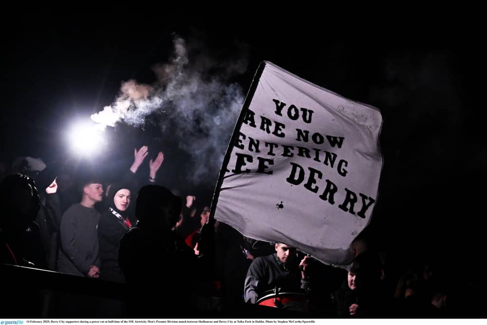 Derry City supporters during a power cut at half-time of the clash against Shelbourne at Tolka Park in Dublin. Photo by Stephen McCarthy/Sportsfile