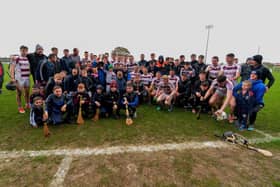 Slaughtneil celebrate with the Senior Hurling Championship trophy after the win over Banagher at Owenbeg. Photo: George Sweeney