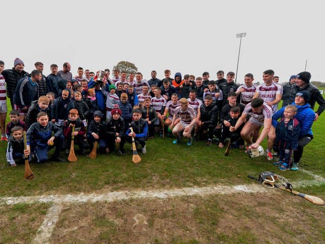 Slaughtneil celebrate with the Senior Hurling Championship trophy after the win over Banagher at Owenbeg. Photo: George Sweeney