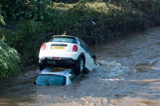 Cars in the River Faughan after catastrophic flooding in August 2017.