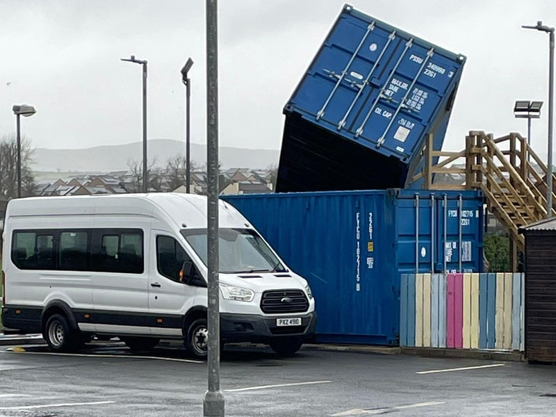 A shipping container blown over by Storm Éowyn at the Rainbow Centre in Galliagh.
