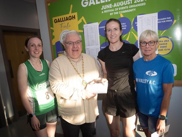 LADIES WINNERS. . . The Deputy Mayor, Darren Guy presenting the Galliagh Feile 5k winner Sarah Grant with her prize on Friday night. On left is Clare McDaid, 3rd, and on right, Itra Kelly, 2nd. (Photos: Jim McCafferty Photography)