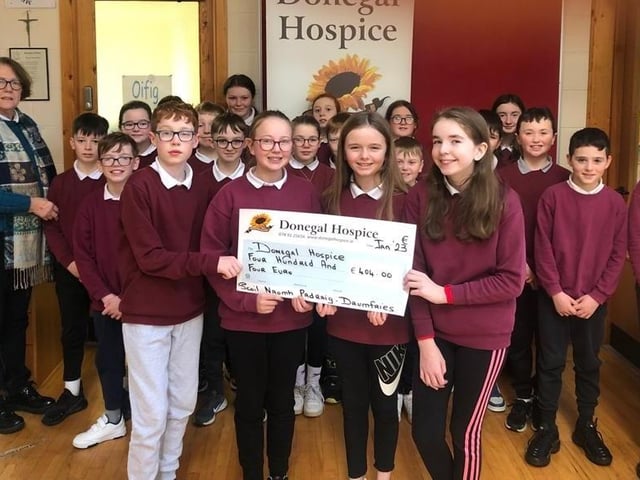 Pupils from Scoil Naomh Padraig, Drumfries, Inishowen, presenting Deirdre Trearty of Donegal Hospice with a cheque for €404.00 raised at their Christmas draw.