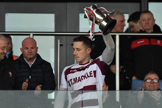 Slaughtneil Mark McGuigan with the Fr Collins after their defeat of Banagher in Saturday’s final at Owenbeg. Photo: George Sweeney