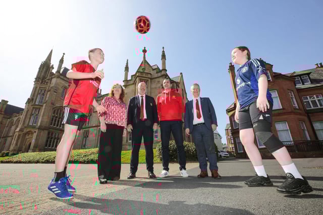 Manchester United Foundation participants Daniel and Bryanne showing off their football skills at the event. Looking on are Shona McCarthy, chair, International Fund for Ireland, John Shiels, CEO, Manchester United Foundation, former Man. Utd. and Republic of Ireland defender John O’Shea, and Malachy O; Neill, director of Regional Engagement, Ulster University.