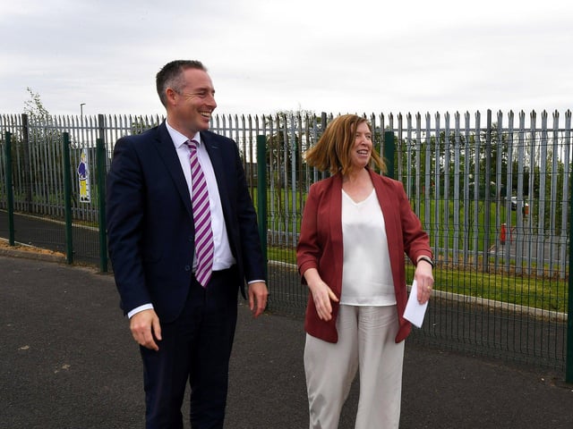 Education Minister Paul Givan is greeted by Principal Máire Mhic Lochlainn on his arrival at Naíscoil Dhoire and Bunscoil Cholmcille, Steelstown, on Wednesday. Photo: George Sweeney