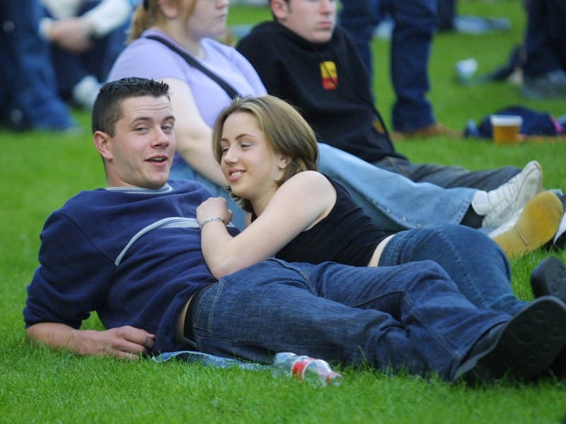 Young love on a hot evening in Prehen at the Bryan Adams concert.(2808JB19)