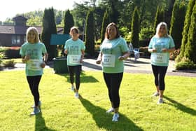 L to R – Bridgeen Byrne, Mary McDaid ,Alexandra McLaughlin, Maria McCarron recreating their iconic photo from the Foyle Hospice Female Walk/Run in 1984.
