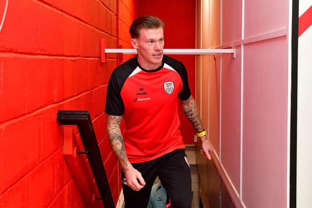James McClean makes his way up the stairs to the press conference at Derry City's club offices on Saturday afternoon.
