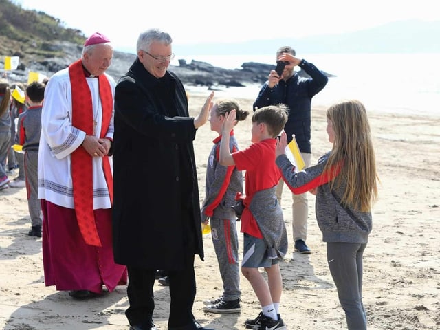 His Excellency Archbishop Luis. Mariano Montemayor, Papal Nuncio and Dean of the Diplomatic Corps 'high fives' pupils from Scoil Iosagain, Buncrana. Picture courtesy of Tom Heaney.