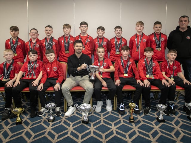 Special guest Stephen McKendry presenting Newell Academy U-12s with their trophy at the Annual D&D Youth FA awards on Friday night. Included is coach Paul Doherty. (Photos: Jim McCafferty Photography)