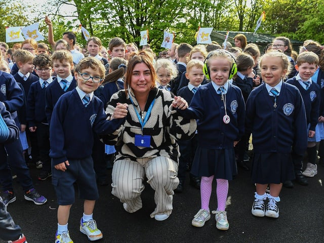 Teacher with pupils at the Jive Aces performance at Rosemount Primary School on Thursday morning. Photo: George Sweeney