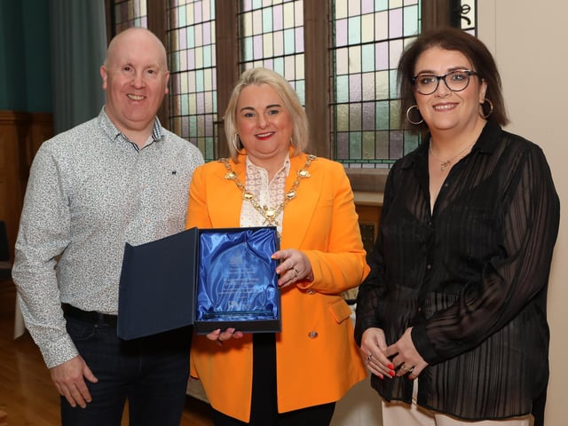 Mayor Sandra Duffy makes a presentation to Legenderry Relay for Life committee members Sean Hickey and Laura Moore in recognition of the outstanding fundraising efforts by the group for Cancer Research UK at a reception held in the Guildhall. (Photo - Tom Heaney, nwpresspics)