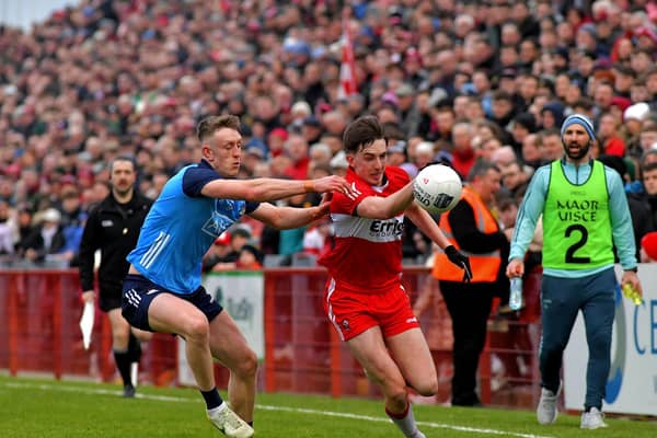 Derry's Niall Toner is tackled by Tom Lahiff of Dublin. (Photo: George Sweeney)
