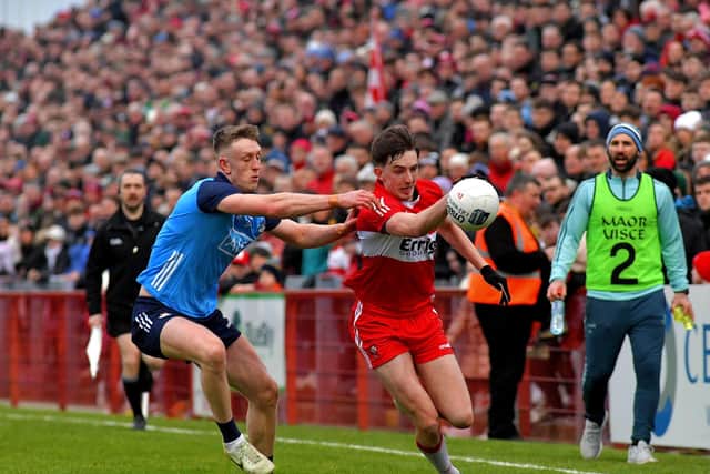 Derry's Niall Toner is tackled by Tom Lahiff of Dublin. (Photo: George Sweeney)