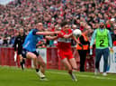Derry's Niall Toner is tackled by Tom Lahiff of Dublin. (Photo: George Sweeney)