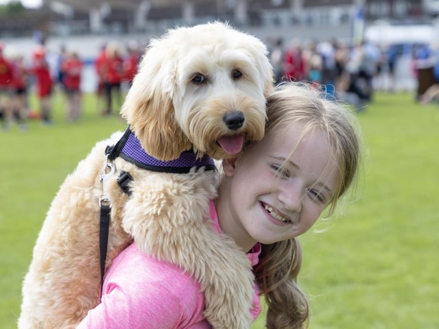 Cody taking a piggy back on his owner Eva Johnston during the half Marathon. (North West Newspxi)