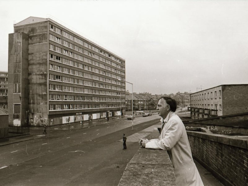 Dr Raymond McClean at Rossville Street with the Rossville flats in the background.