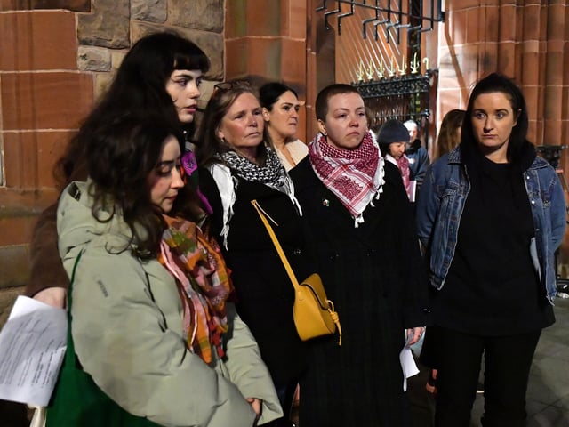 People who read out the names of females who lost their lives through violence during the past four years displayed at the Rally for Women's Safety held in the Guildhall Square on Friday evening with one of the organisers, Colr. Catherine McDaid (right). Photo: George Sweeney