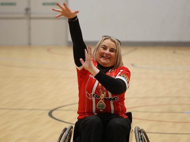 The Mayor of Derry, Councillor Sandra Duffy, attempts’ a basket’ at the NW Wolves Wheelchair Basketball Club Community Launch Day at Shantallow Community Centre.