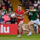 Eoin McEvoy of Derry is tackled by Eoghan Frayne of Meath during the GAA Football All-Ireland Senior Championship Round 2B match between Derry and Meath at Find Insurance Celtic Park in Derry. Photo by Ben McShane/Sportsfile