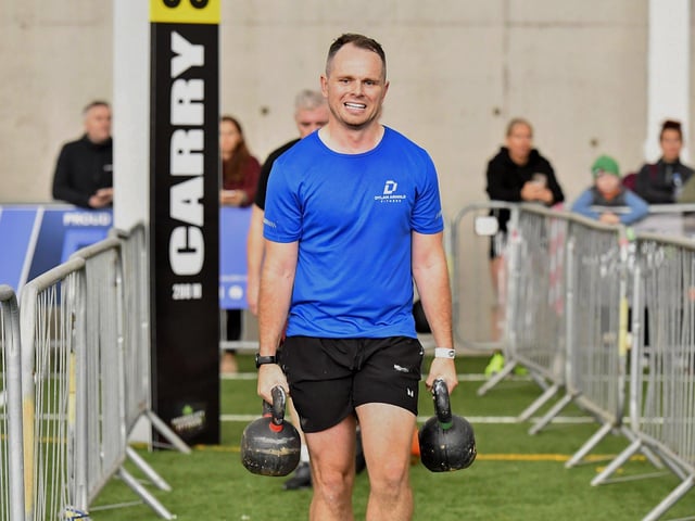 Competitor takes part in ‘Farmers Carry’ during the Maiden City Hyrox V Fitness Challenge held at Sean Dolans GAC on Saturday. Photograph: George Sweeney